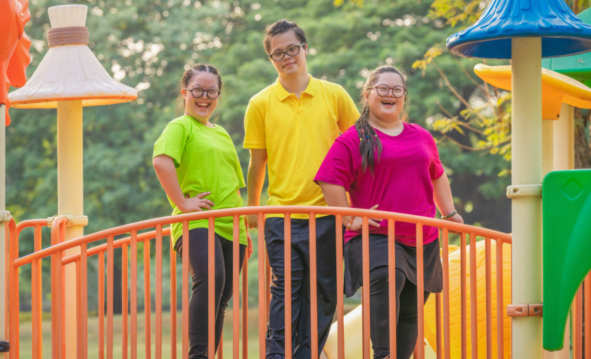 Three people at the swimming pool area