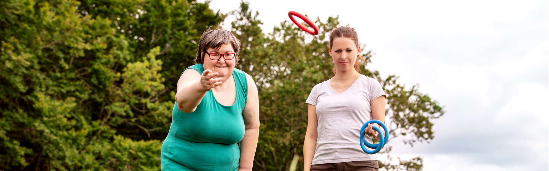 woman with senior woman outdoors