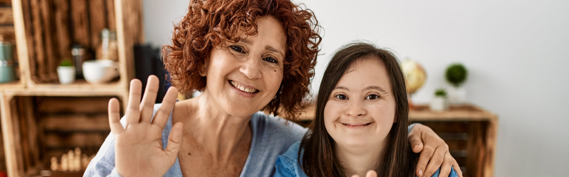 A woman and young girl smiling